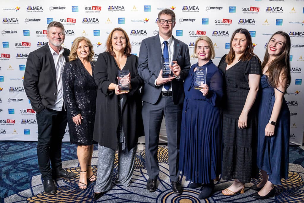 The ICMSA team celebrating with trophies at the MEA Awards